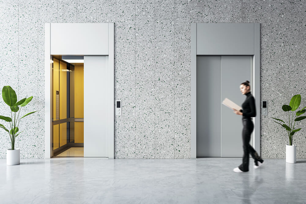 Woman in lobby near elevators